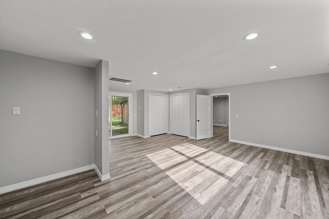 5615 Carlburt St, West Bloomfield, MI 48322 - unfurnished bedroom with wood finished floors and recessed lighting