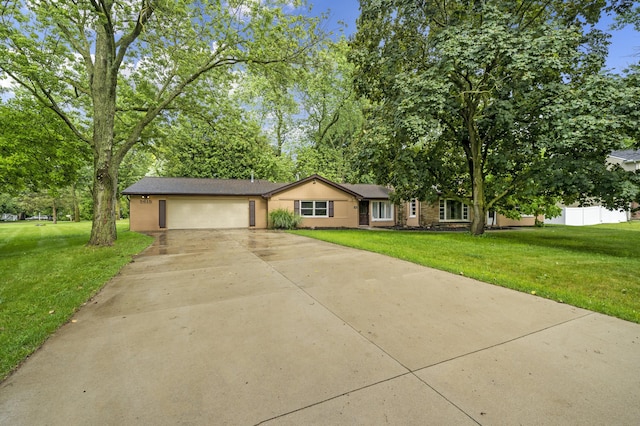5615 Carlburt St, West Bloomfield, MI 48322 - view of front of house with an attached garage, driveway, a front lawn, and view of wooded area