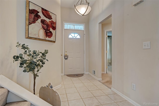 333 Sherman Ct, Ortonville, MI 48462 - foyer featuring light tile patterned floors and stairs