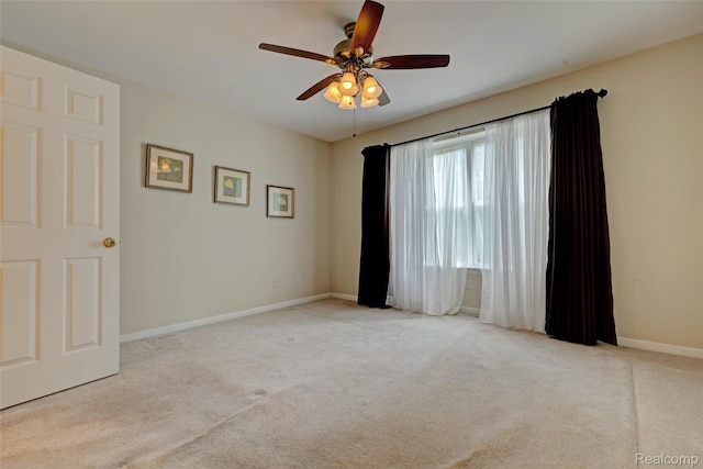 333 Sherman Ct, Ortonville, MI 48462 - carpeted empty room with a ceiling fan and baseboards