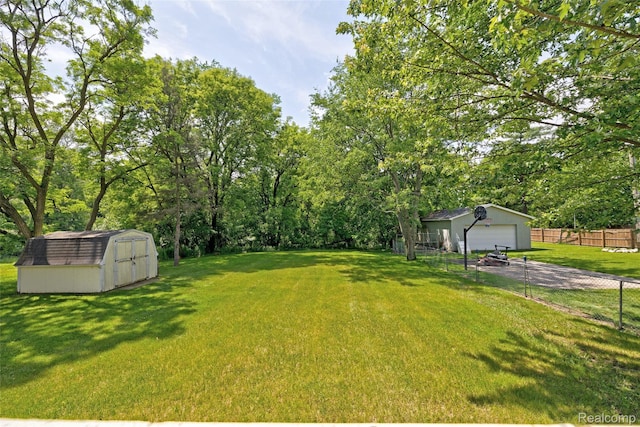 333 Sherman Ct, Ortonville, MI 48462 - view of yard featuring a detached garage and a storage shed