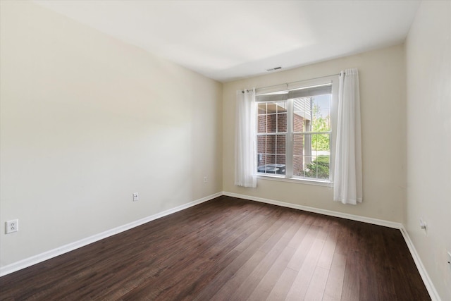 3328 Primrose Ln, Ypsilanti, MI 48197 - spare room with dark wood-style floors and baseboards
