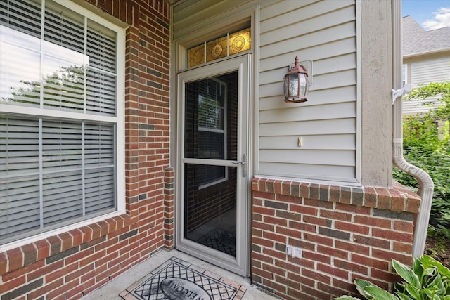 3328 Primrose Ln, Ypsilanti, MI 48197 - doorway to property with brick siding and covered porch