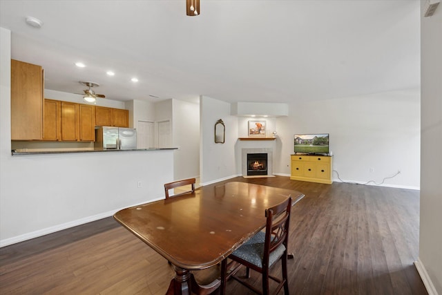 3328 Primrose Ln, Ypsilanti, MI 48197 - dining room featuring a ceiling fan, dark wood-type flooring, a tile fireplace, and recessed lighting