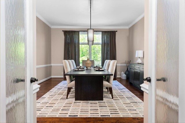 1303 Towsley Ln, Ann Arbor, MI 48105 - dining area with dark wood-type flooring and ornamental molding