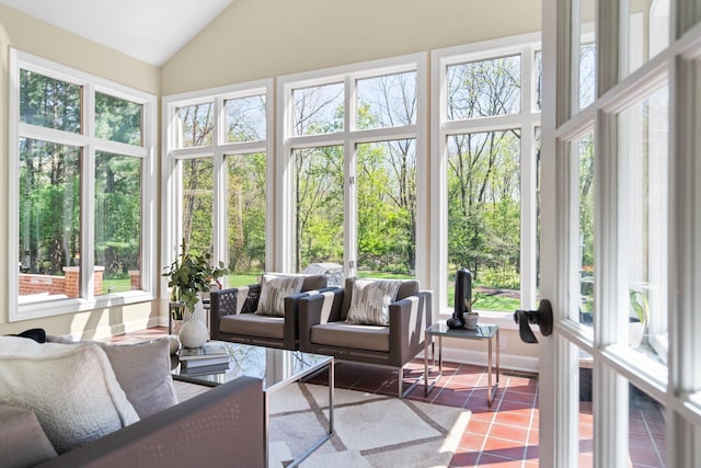 1303 Towsley Ln, Ann Arbor, MI 48105 - sunroom with healthy amount of natural light, tile patterned flooring, and high vaulted ceiling