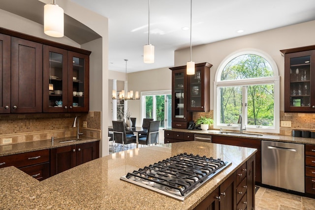 1303 Towsley Ln, Ann Arbor, MI 48105 - kitchen featuring stainless steel appliances, light stone counters, decorative backsplash, dark brown cabinets, and recessed lighting