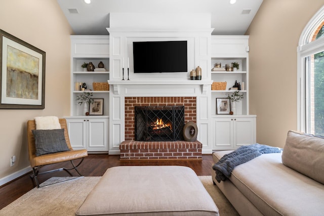 1303 Towsley Ln, Ann Arbor, MI 48105 - living room with dark wood-style flooring, a brick fireplace, and recessed lighting