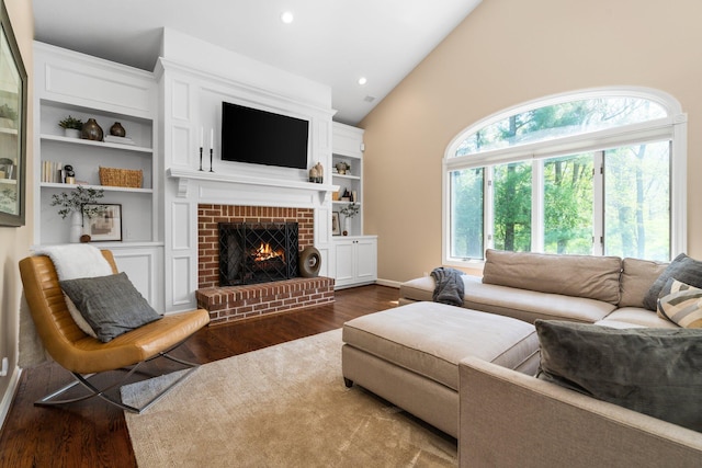 1303 Towsley Ln, Ann Arbor, MI 48105 - living room with dark wood-type flooring, a brick fireplace, vaulted ceiling, and recessed lighting