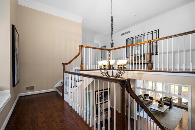 1303 Towsley Ln, Ann Arbor, MI 48105 - staircase with a chandelier, crown molding, and wood finished floors