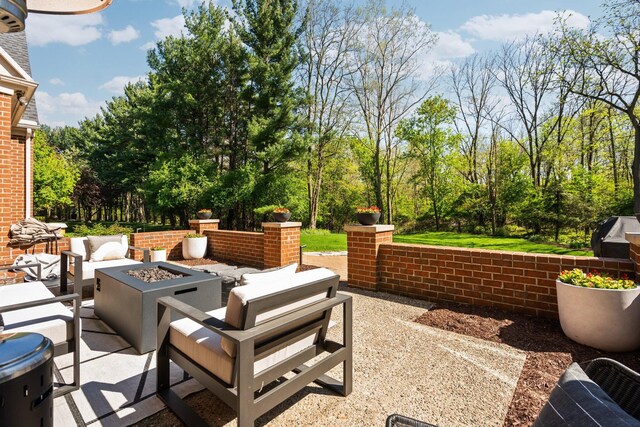 1303 Towsley Ln, Ann Arbor, MI 48105 - view of patio featuring an outdoor living space with a fire pit