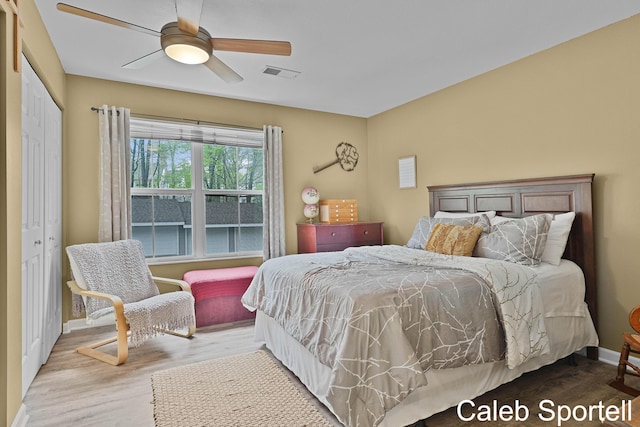 3360 Pine Meadow Dr SE Unit 202, Kentwood, MI 49512 - bedroom with wood finished floors, a closet, and ceiling fan
