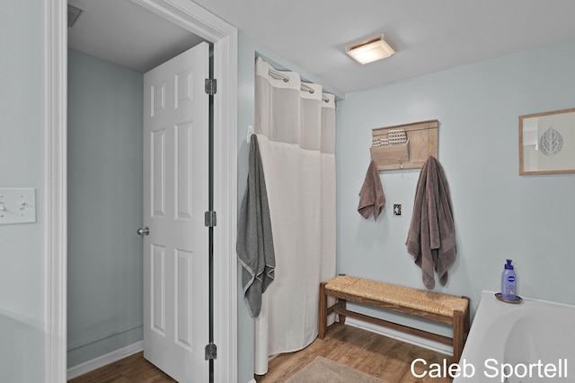 3360 Pine Meadow Dr SE Unit 202, Kentwood, MI 49512 - bathroom with wood finished floors and a tub