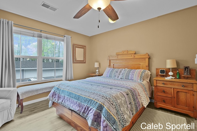 3360 Pine Meadow Dr SE Unit 202, Kentwood, MI 49512 - bedroom featuring light wood-style floors and a ceiling fan