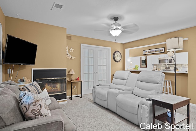 3360 Pine Meadow Dr SE Unit 202, Kentwood, MI 49512 - carpeted living room with a ceiling fan and a glass covered fireplace