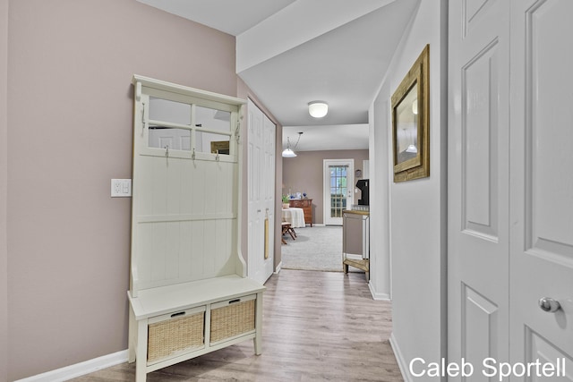 3360 Pine Meadow Dr SE Unit 202, Kentwood, MI 49512 - mudroom featuring light wood finished floors and baseboards