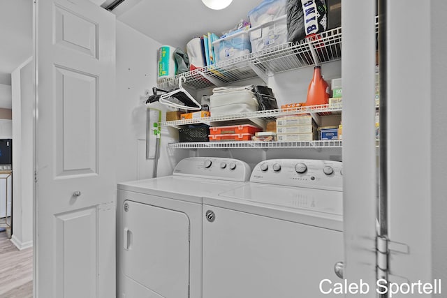 3360 Pine Meadow Dr SE Unit 202, Kentwood, MI 49512 - washroom with washer and clothes dryer and wood finished floors