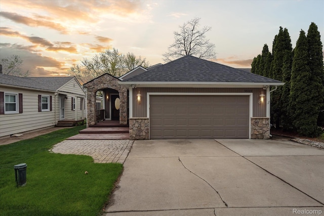 9669 Norman Rd, Clarkston, MI 48348 - view of front of house featuring stone siding, driveway, board and batten siding, and an attached garage
