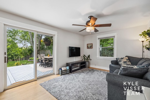 1624 Boston St SE, Grand Rapids, MI 49506 - living area featuring plenty of natural light, wood finished floors, and a ceiling fan