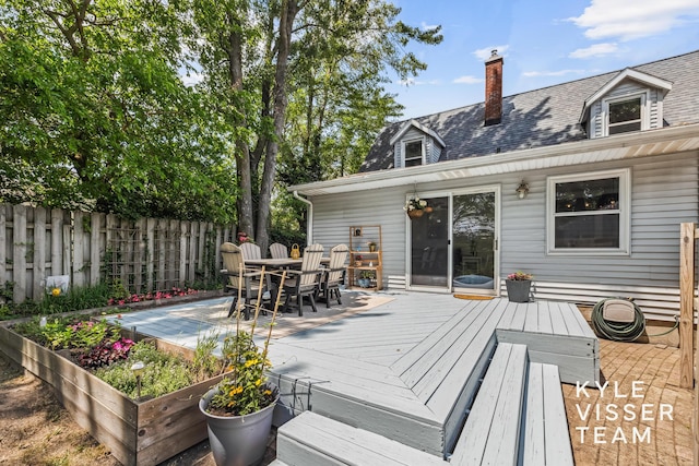 1624 Boston St SE, Grand Rapids, MI 49506 - deck with outdoor dining area and a garden