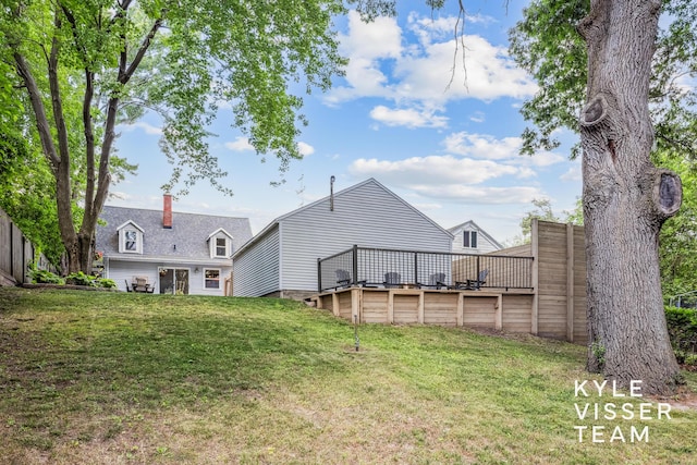 1624 Boston St SE, Grand Rapids, MI 49506 - back of house with a wooden deck and a yard