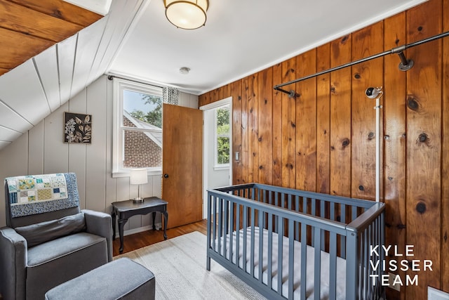 1624 Boston St SE, Grand Rapids, MI 49506 - bedroom with wood finished floors, lofted ceiling, and a nursery area
