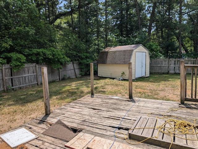 197 E Cedar Rd, Twin Lake, MI 49457 - wooden terrace featuring a shed and a fenced backyard