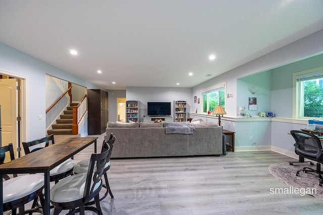 3440 Monterey Hills Dr NE, Grand Rapids, MI 49525 - dining room featuring recessed lighting, light wood finished floors, and stairway