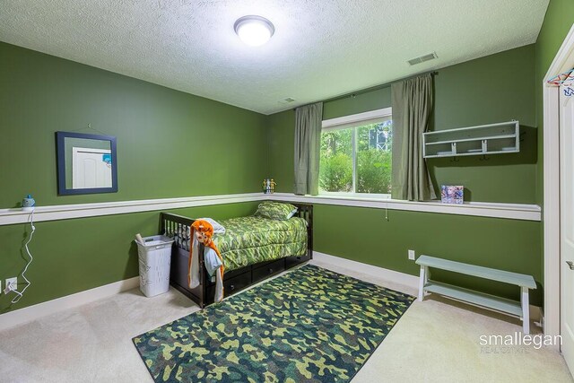 3440 Monterey Hills Dr NE, Grand Rapids, MI 49525 - bedroom with carpet floors and a textured ceiling