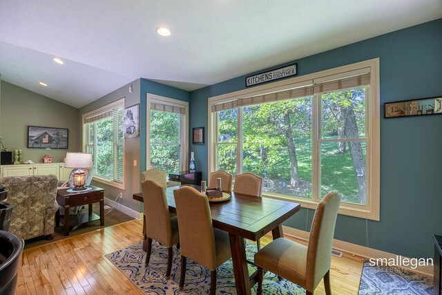 3440 Monterey Hills Dr NE, Grand Rapids, MI 49525 - dining room featuring plenty of natural light, light wood-style flooring, recessed lighting, and vaulted ceiling