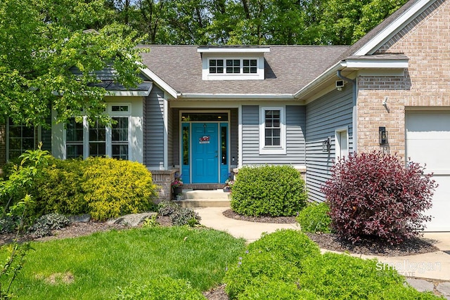 3440 Monterey Hills Dr NE, Grand Rapids, MI 49525 - view of front of property featuring a garage and roof with shingles