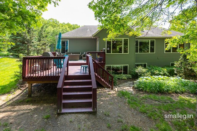 3440 Monterey Hills Dr NE, Grand Rapids, MI 49525 - back of property featuring a deck, stairs, and a shingled roof