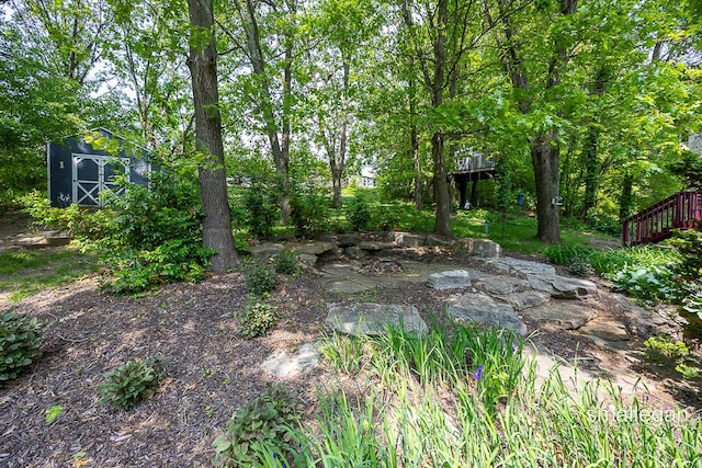 3440 Monterey Hills Dr NE, Grand Rapids, MI 49525 - view of yard with a storage shed