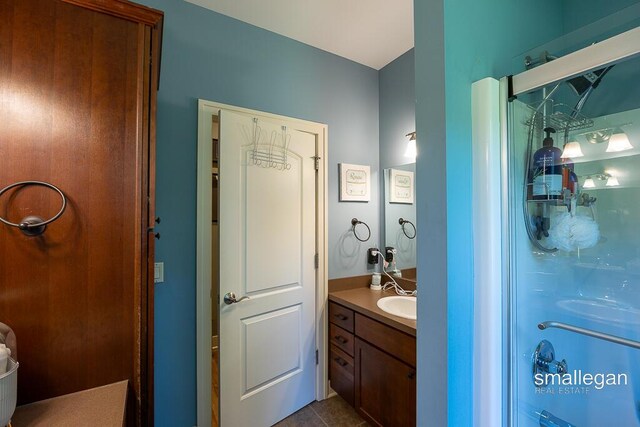 3440 Monterey Hills Dr NE, Grand Rapids, MI 49525 - full bath with vanity and tile patterned floors