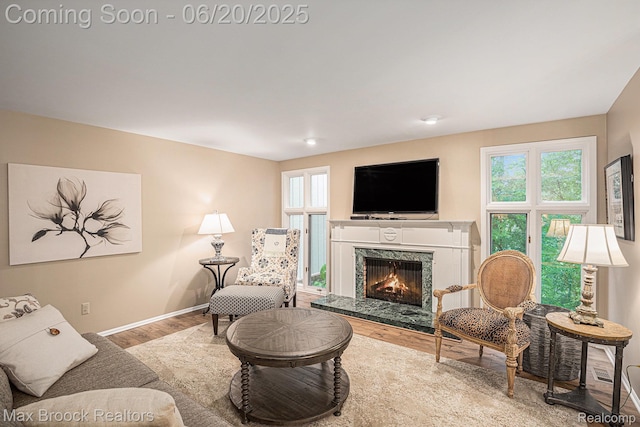 1337 Knollcrest Cir, Bloomfield Hills, MI 48304 - living room featuring wood finished floors, plenty of natural light, and a high end fireplace