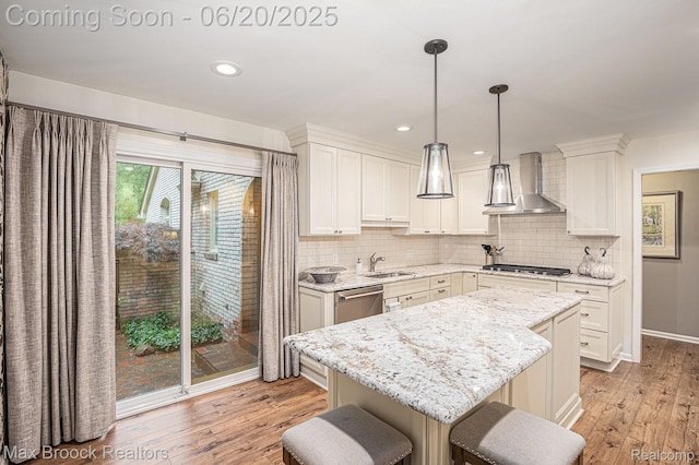 1337 Knollcrest Cir, Bloomfield Hills, MI 48304 - kitchen with wall chimney range hood, stainless steel appliances, light wood-style flooring, backsplash, and recessed lighting