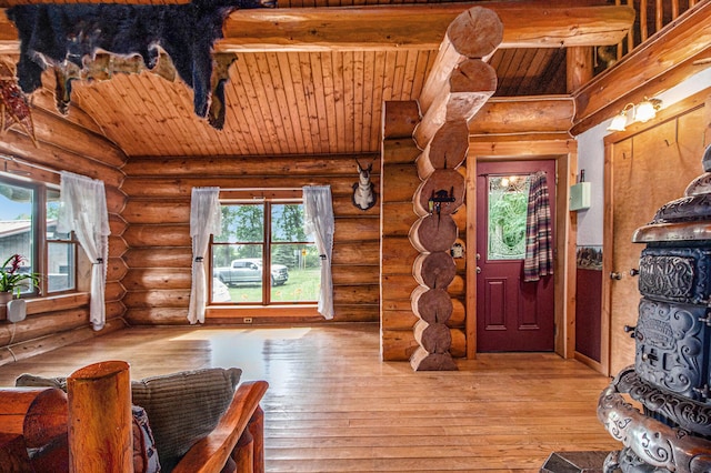 12170 Riethmiller Rd, Grass Lake, MI 49240 - foyer entrance featuring wooden ceiling, rustic walls, and wood-type flooring