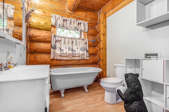 12170 Riethmiller Rd, Grass Lake, MI 49240 - full bathroom featuring rustic walls, wood finished floors, a freestanding bath, healthy amount of natural light, and vanity
