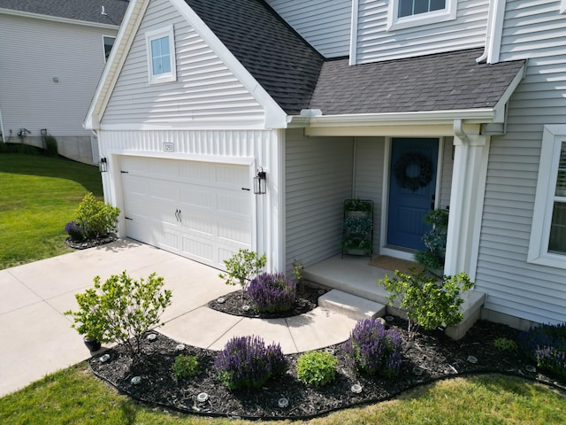 3293 Creek Ridge Dr, Hudsonville, MI 49426 - property entrance featuring roof with shingles, a yard, concrete driveway, and an attached garage