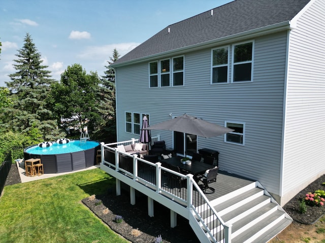 3293 Creek Ridge Dr, Hudsonville, MI 49426 - back of house featuring an outdoor hangout area, a deck, a pool, a lawn, and outdoor dining space