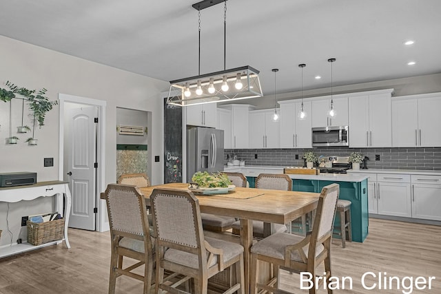 3293 Creek Ridge Dr, Hudsonville, MI 49426 - dining area featuring light wood-type flooring and recessed lighting