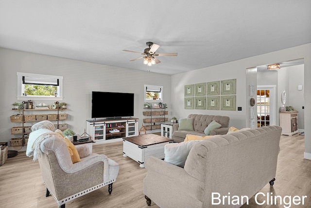 3293 Creek Ridge Dr, Hudsonville, MI 49426 - living room featuring a ceiling fan and light wood-type flooring