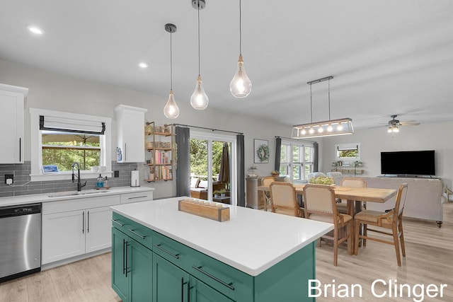 3293 Creek Ridge Dr, Hudsonville, MI 49426 - kitchen featuring stainless steel dishwasher, green cabinets, white cabinetry, a ceiling fan, and light wood-type flooring