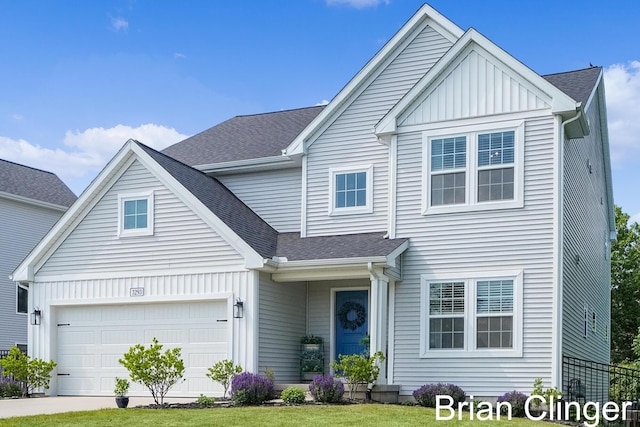 3293 Creek Ridge Dr, Hudsonville, MI 49426 - traditional-style home featuring board and batten siding, roof with shingles, a garage, and driveway