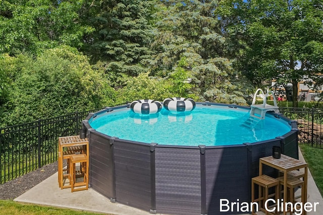 3293 Creek Ridge Dr, Hudsonville, MI 49426 - view of pool with a hot tub and a patio area