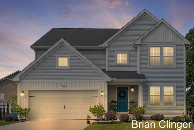 3293 Creek Ridge Dr, Hudsonville, MI 49426 - view of front of home with board and batten siding, concrete driveway, a garage, and roof with shingles