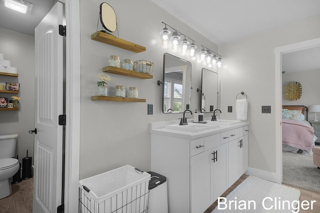3293 Creek Ridge Dr, Hudsonville, MI 49426 - ensuite bathroom featuring toilet and double vanity