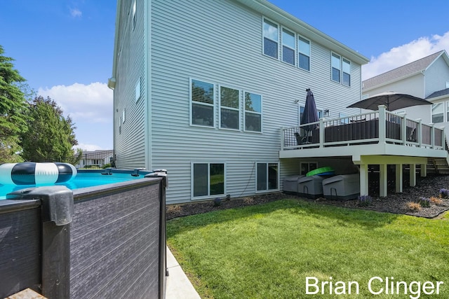 3293 Creek Ridge Dr, Hudsonville, MI 49426 - back of house featuring a deck and a lawn