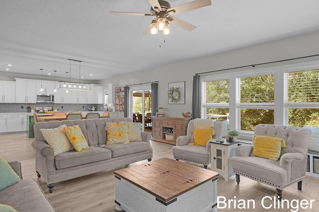 3293 Creek Ridge Dr, Hudsonville, MI 49426 - living area featuring light wood-style floors, ceiling fan, and recessed lighting