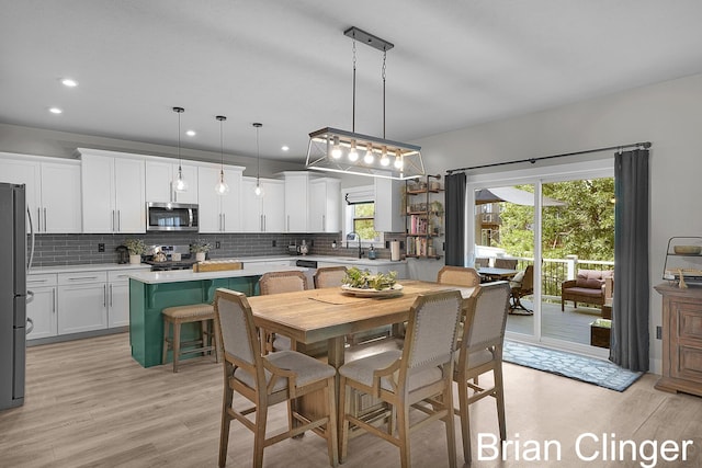 3293 Creek Ridge Dr, Hudsonville, MI 49426 - dining room featuring light wood-type flooring and recessed lighting